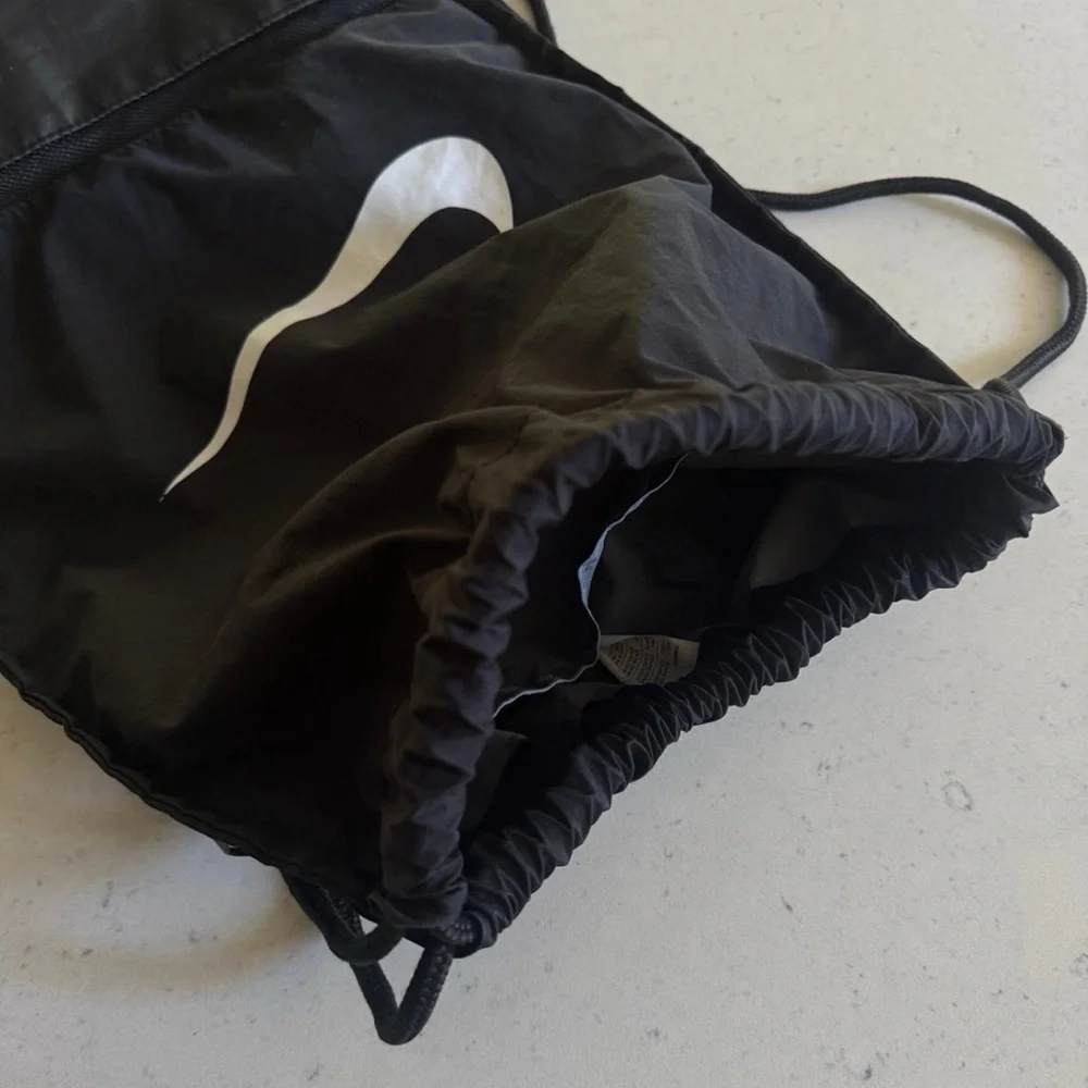 Nike Black Drawstring Backpack with White Swoosh